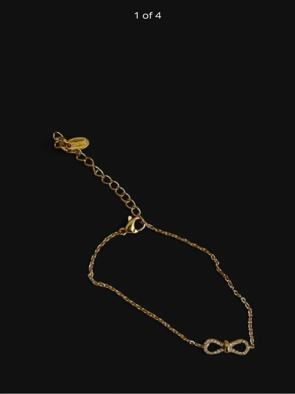 Stainless Steel Gold Infinity Bracelet With Rhinestones.
